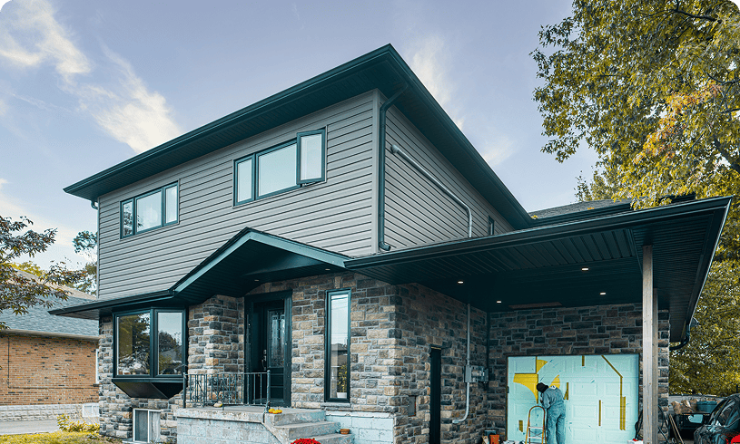Modern two-story house with stone exterior.