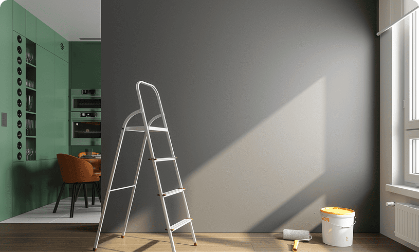 Ladder and paint supplies in modern room.