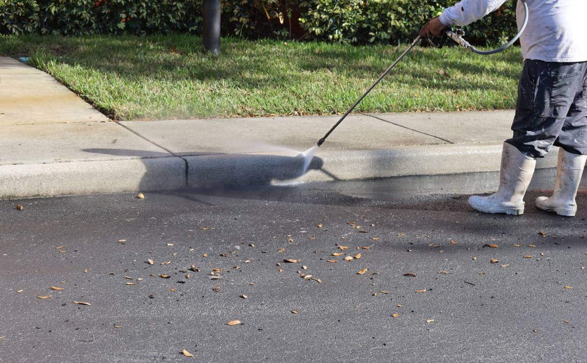 Cleaning road with water spray