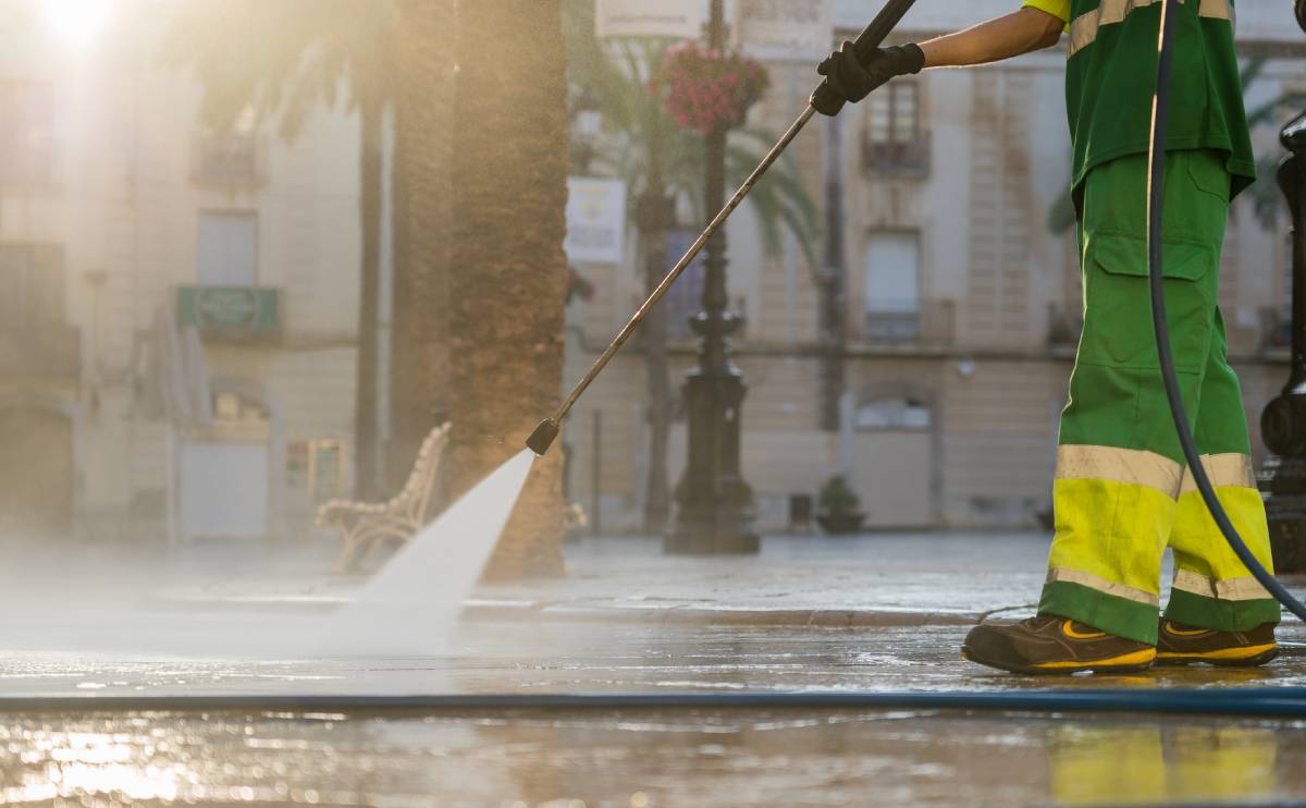 Street cleaner using a power washer