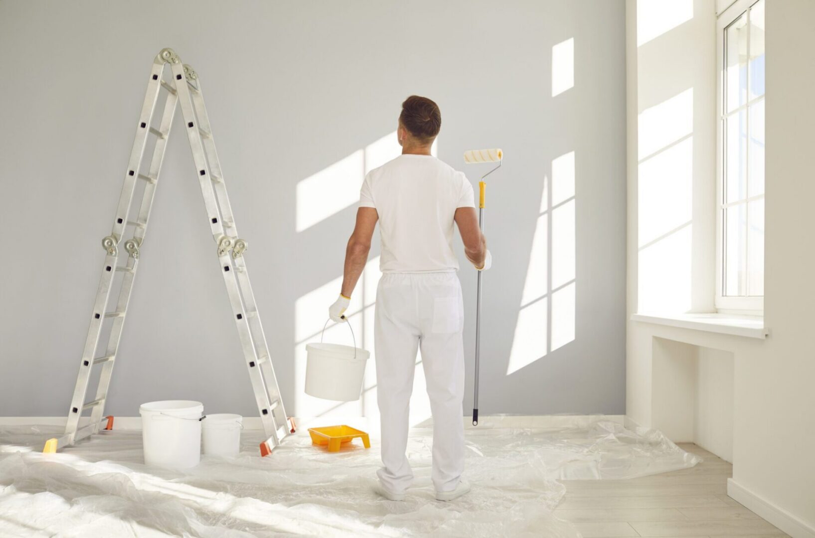 Painter preparing to paint a wall